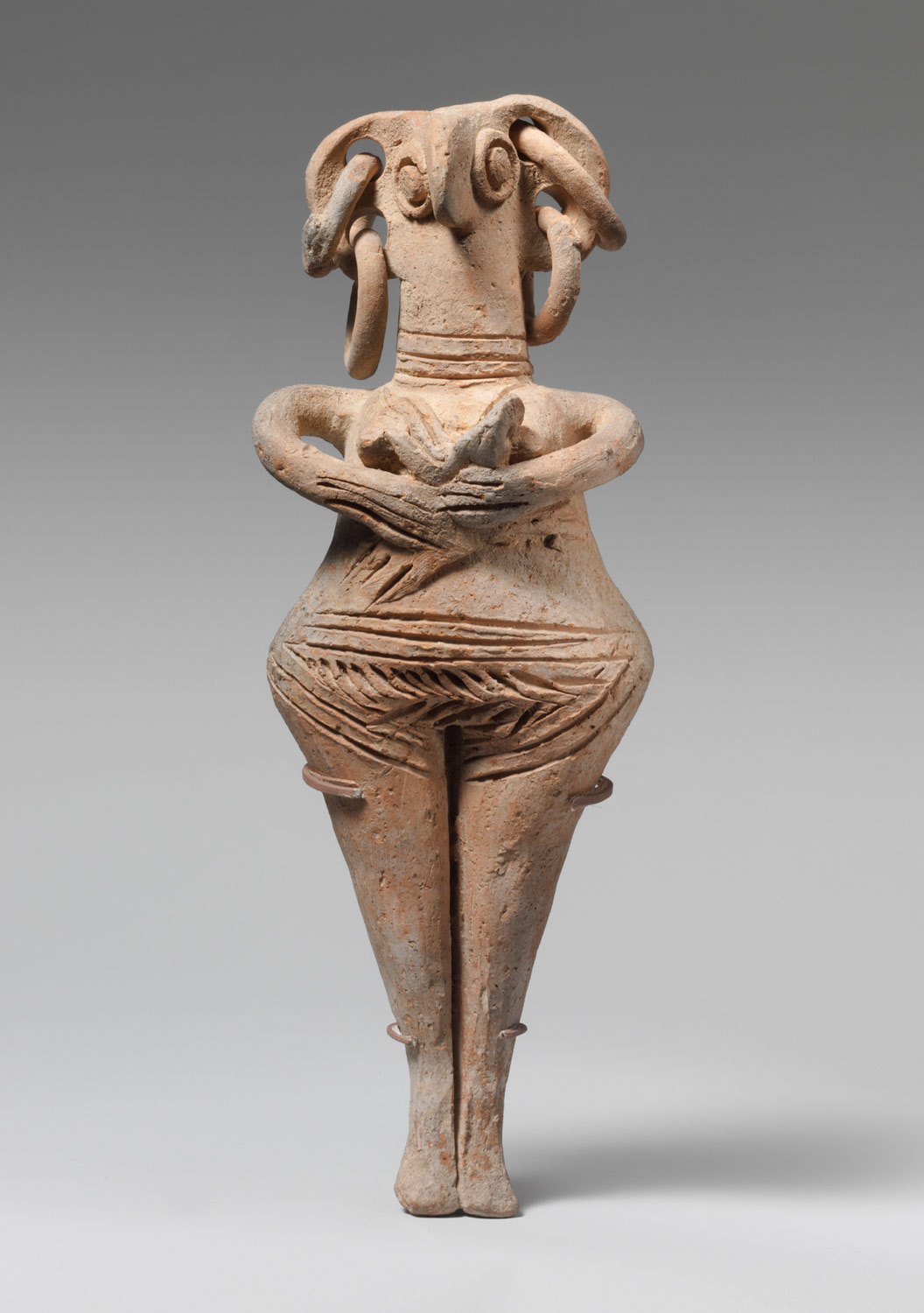 Terracotta statuette of woman with bird face