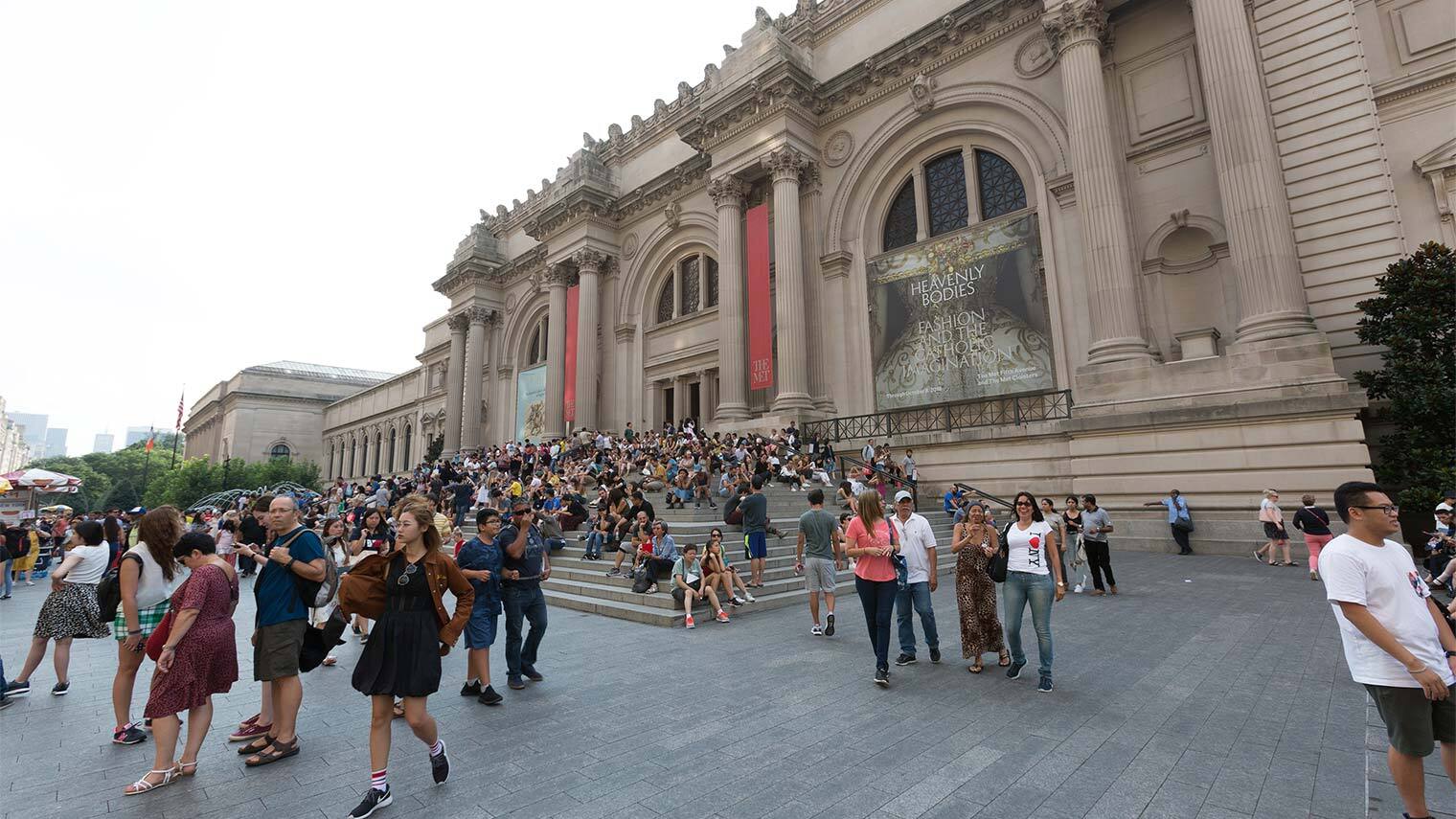A photo of a crowd gathered in The Met's plaza