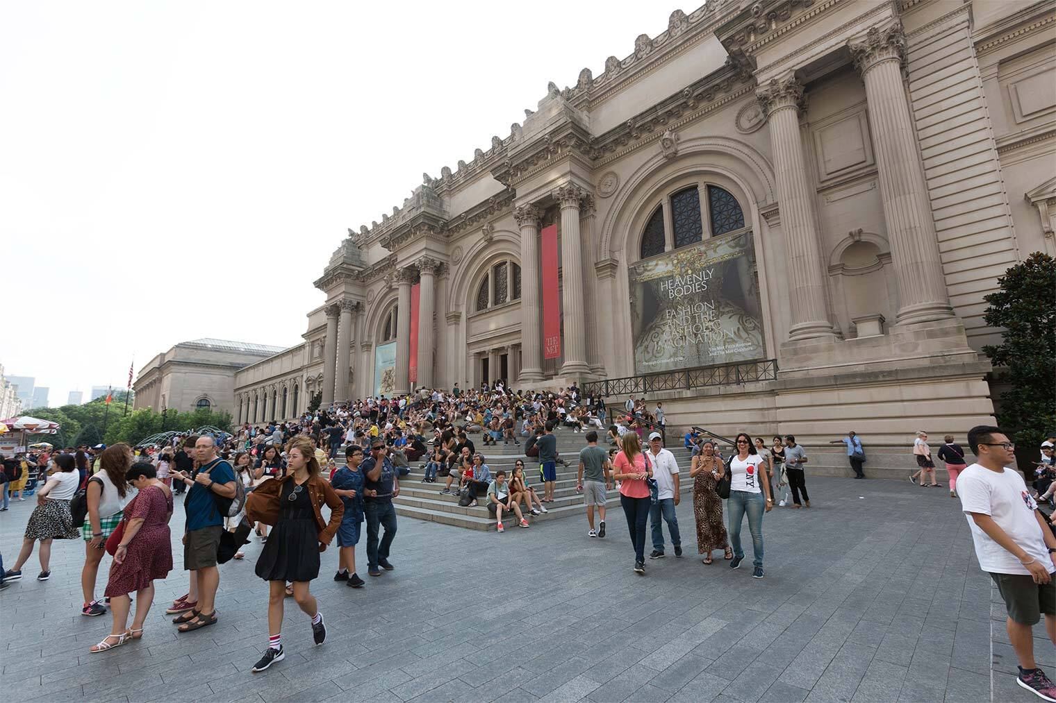 A photo of a crowd gathered in The Met's plaza